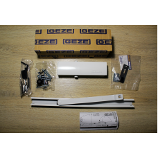 Дверний доводчик GEZE TS 1500 G з ковзною шиною з фіксацією, білий